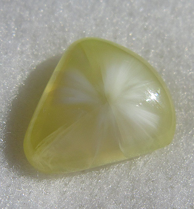 white fibro-radiated inclusions in australian prehnite